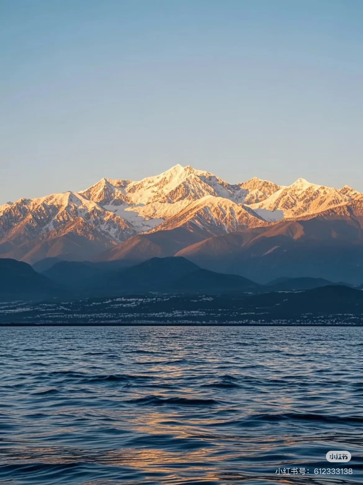 Cangshan Mountain's 19 peaks rise sharply above Dali Ancient City, with the Jade Belt Road winding through pine forests and offering panoramic views of Erhai Lake below